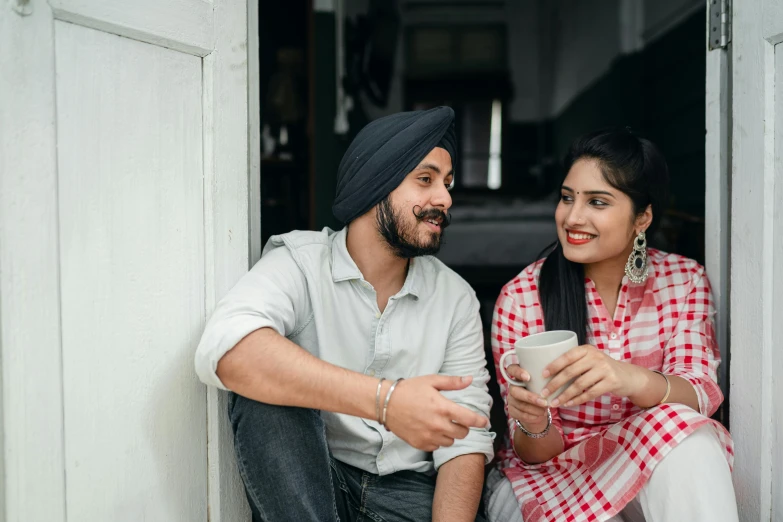 a man and a woman sitting next to each other, inspired by Manjit Bawa, pexels contest winner, flirting smiling, 15081959 21121991 01012000 4k, looking around a corner, indian