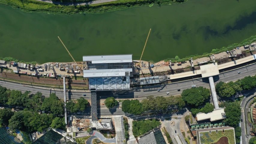 an aerial view of a bridge over a river, inspired by Samuel Silva, opposite the lift-shaft, photo from 2022, monorail station, panorama view