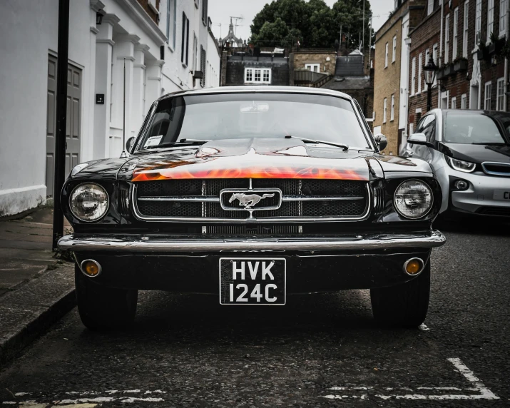 a car parked on the side of a street, pexels contest winner, hyperrealism, mustang, front flash, metal, british street background