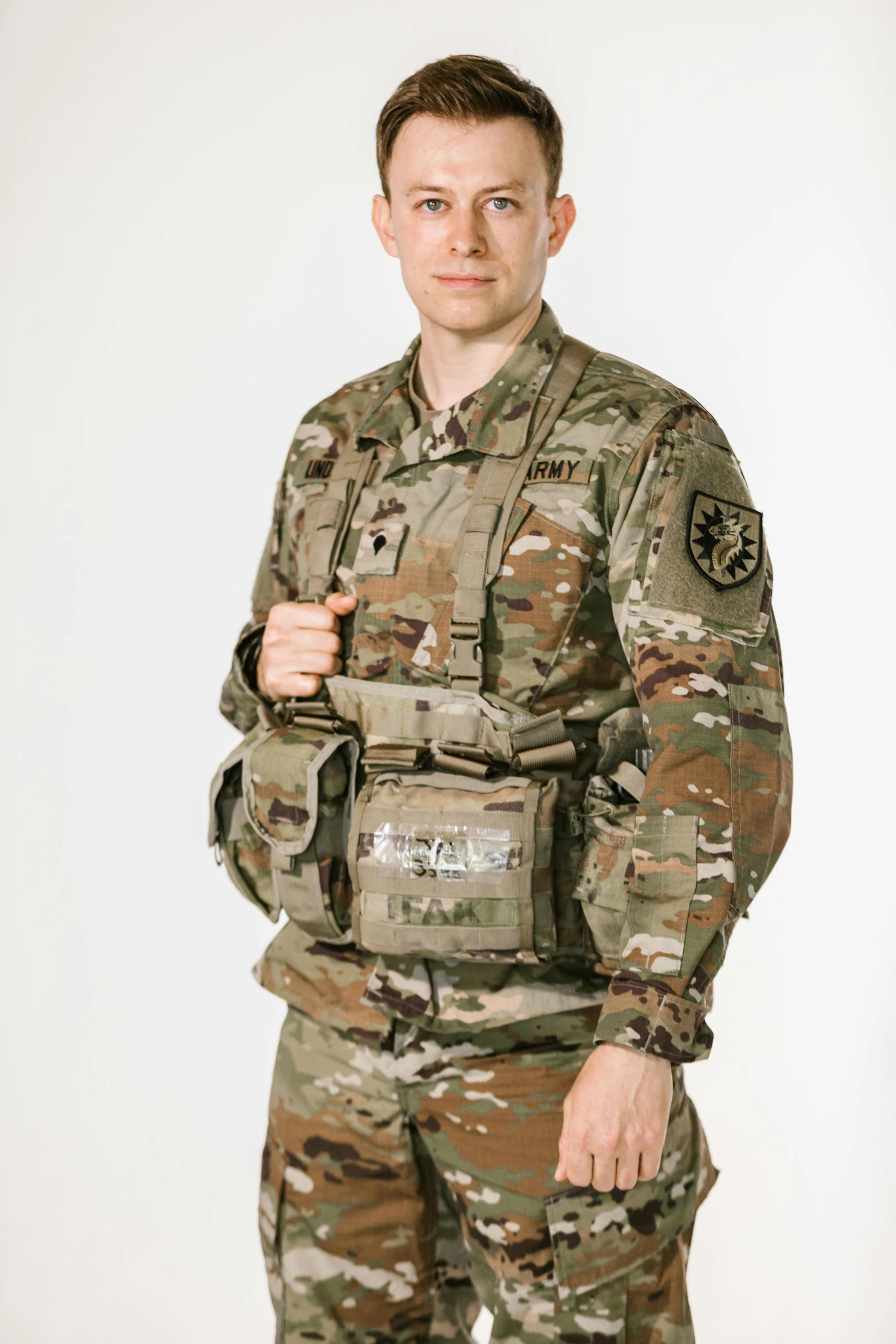 a man in a military uniform poses for a picture, by Lynn Pauley, model is wearing techtical vest, adafruit, detailed product shot, multicam uniform