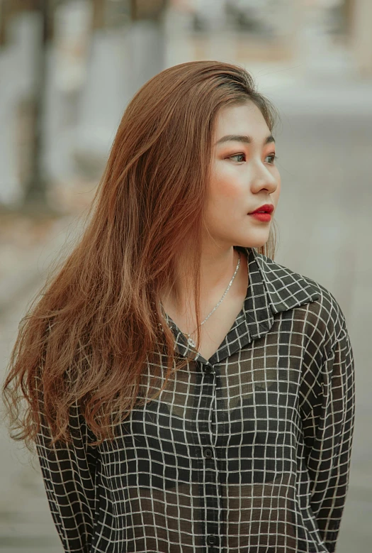 a woman standing in the middle of a street, inspired by Ruth Jên, trending on pexels, asian girl with long hair, wearing a plaid shirt, sophisticated well rounded face, close up portrait photo