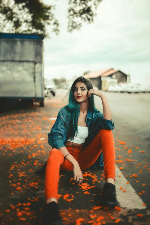 a woman sitting on the side of a road, inspired by Elsa Bleda, trending on pexels, color field, orange roof, teal hair, casual pose, 15081959 21121991 01012000 4k