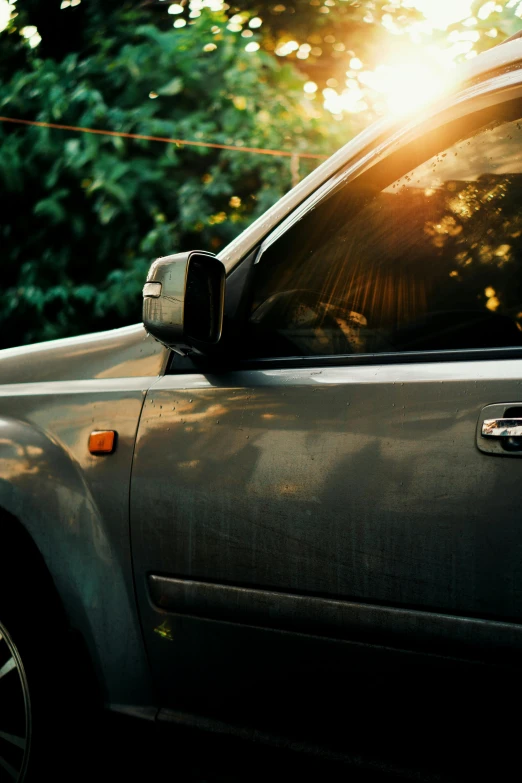 a man riding a skateboard down the side of a road, pexels contest winner, photorealism, 1 9 7 0 s car window closeup, evening sunlight, green pickup car, steel gray body