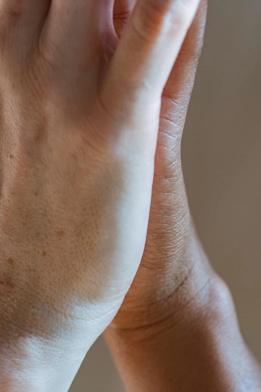 a close up of a person holding a toothbrush, hatched pointed ears, marfan syndrome, partially cupping her hands, muscle striation visible