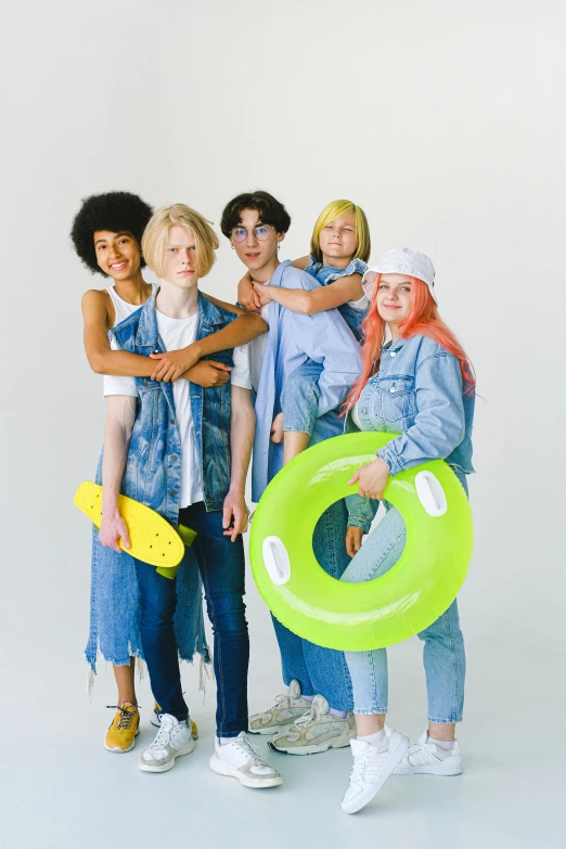 a group of young people standing next to each other, trending on pexels, pop art, albino hair, tubing, wearing denim, inflatable