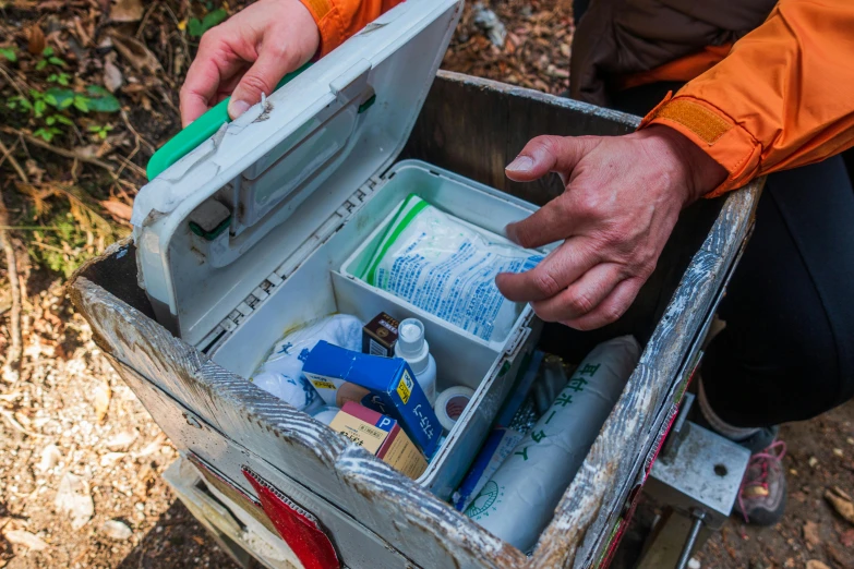 a close up of a person holding a cooler, process art, first aid kit, bioremediation, thumbnail, outdoor photo