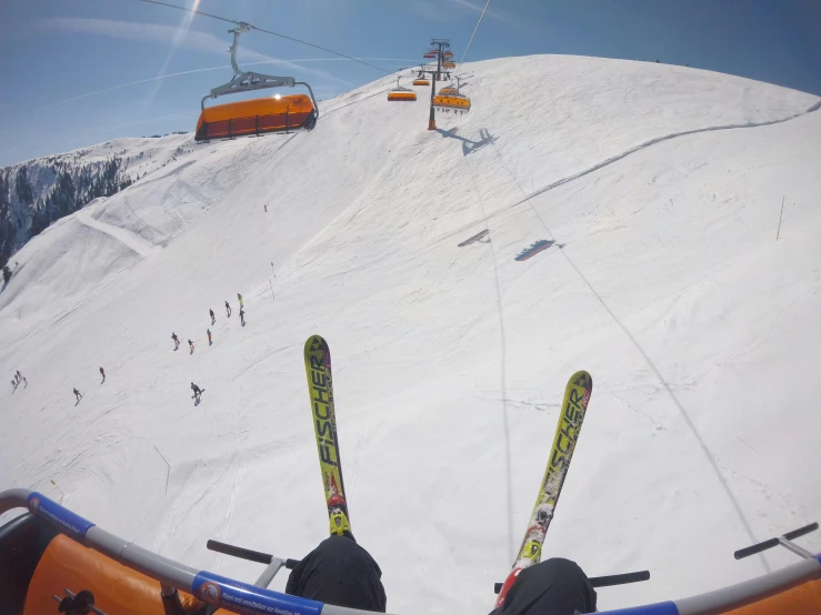 a pair of skis sitting on top of a snow covered slope, pexels contest winner, figuration libre, fish eye view, chairlifts, helmet view, 🌻🎹🎼