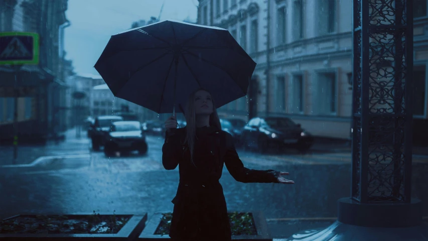 a woman holding an umbrella in the rain, inspired by Elsa Bleda, unsplash contest winner, dark blue tones, 4 k cinematic still, alexey gurylev, underexposed grey