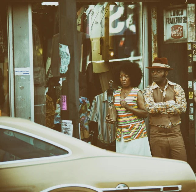 a man and a woman standing in front of a store, an album cover, by Pamela Ascherson, pexels contest winner, funk art, brown, vintage retro colors, looking around a corner, square