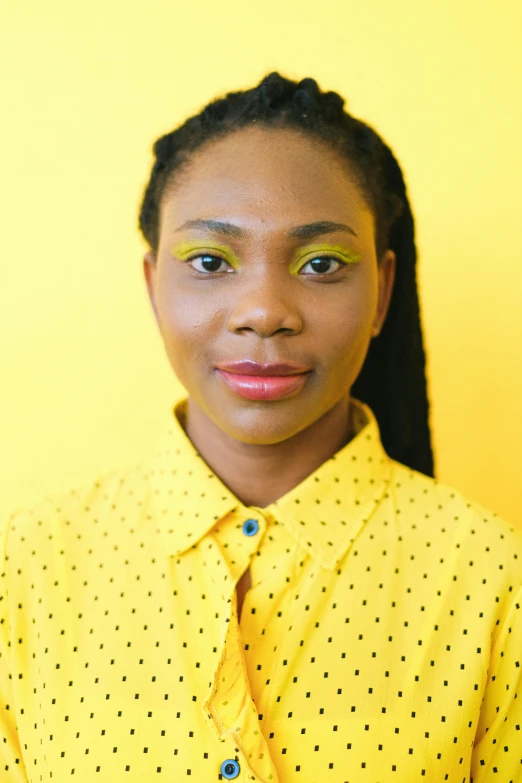 a woman standing in front of a yellow wall, by Chinwe Chukwuogo-Roy, closeup headshot, brightly lit, low quality photo, on clear background