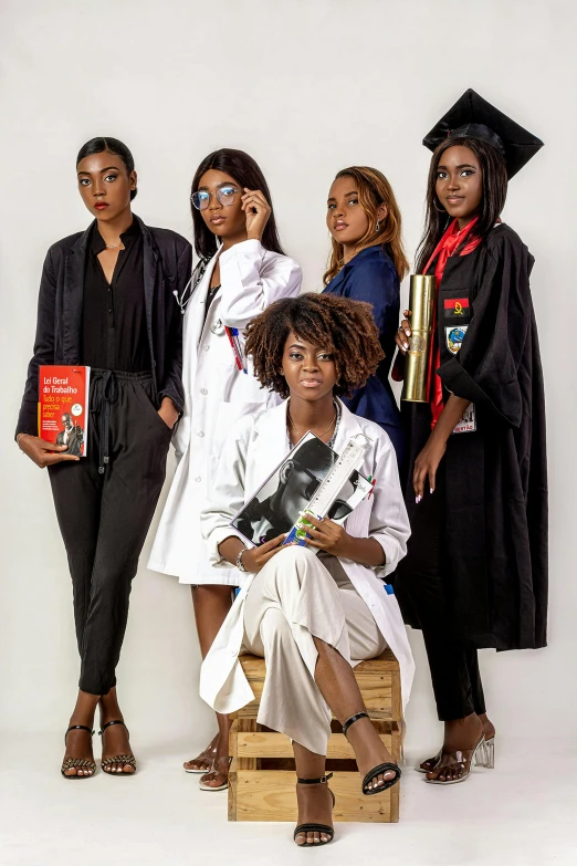 a group of women standing next to each other, a portrait, by Chinwe Chukwuogo-Roy, pexels, academic art, wearing an academic gown, magazine photo shoot, white coat, panel of black