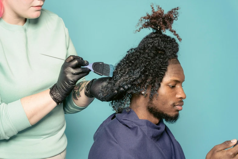 a woman cutting a man's hair with scissors, by Meredith Dillman, trending on pexels, renaissance, a black man with long curly hair, two tone dye, teal color graded, frosting on head and shoulders