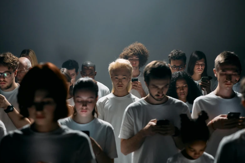 a group of people looking at their cell phones, a hologram, pexels, antipodeans, wearing white clothes, nadav kander, portrait featured on unsplash, ignant