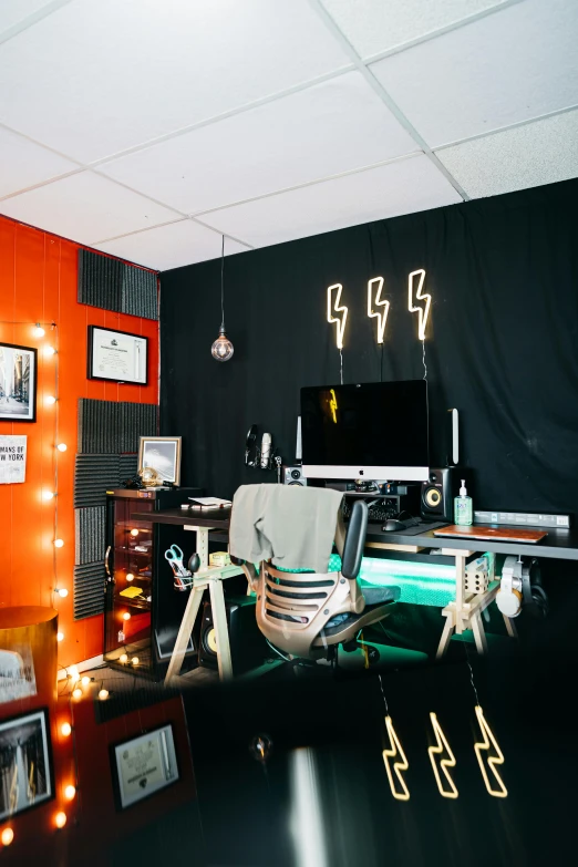 a desk with a computer on top of it, poster art, by Everett Warner, light and space, orange lighting, urban music studio, throne room, panoramic shot