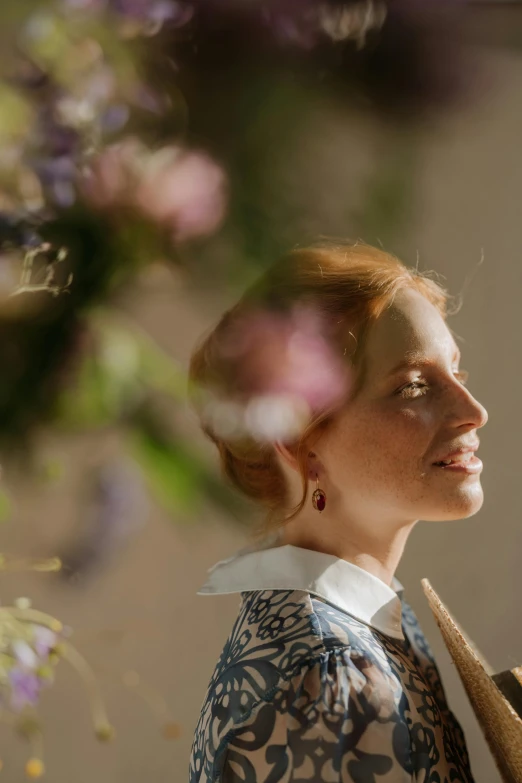 a woman standing in front of a bunch of flowers, a portrait, inspired by Anna Füssli, renaissance, wearing pearl earrings, directional sunlight skewed shot, jessica chastain, a still of an ethereal