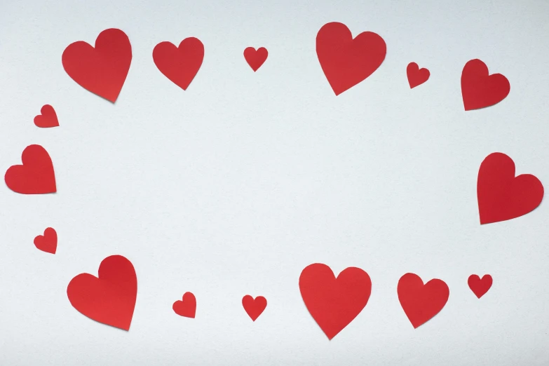 a circle of red paper hearts on a white background, an album cover, pexels, background image, leaked image, thumbnail, unframed