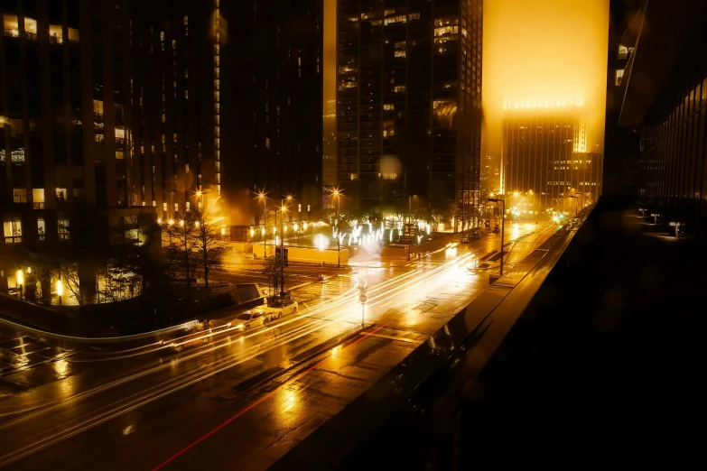 a city street filled with lots of traffic at night, by Andrew Domachowski, pexels contest winner, tonalism, yellow mist, chicago, golden mist, los angeles 2 0 1 5