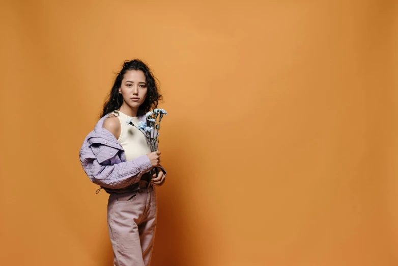 a woman holding a cat in her arms, an album cover, by Gavin Hamilton, pexels contest winner, :: madison beer, award winning studio photo, the woman holds more toys, mingchen shen