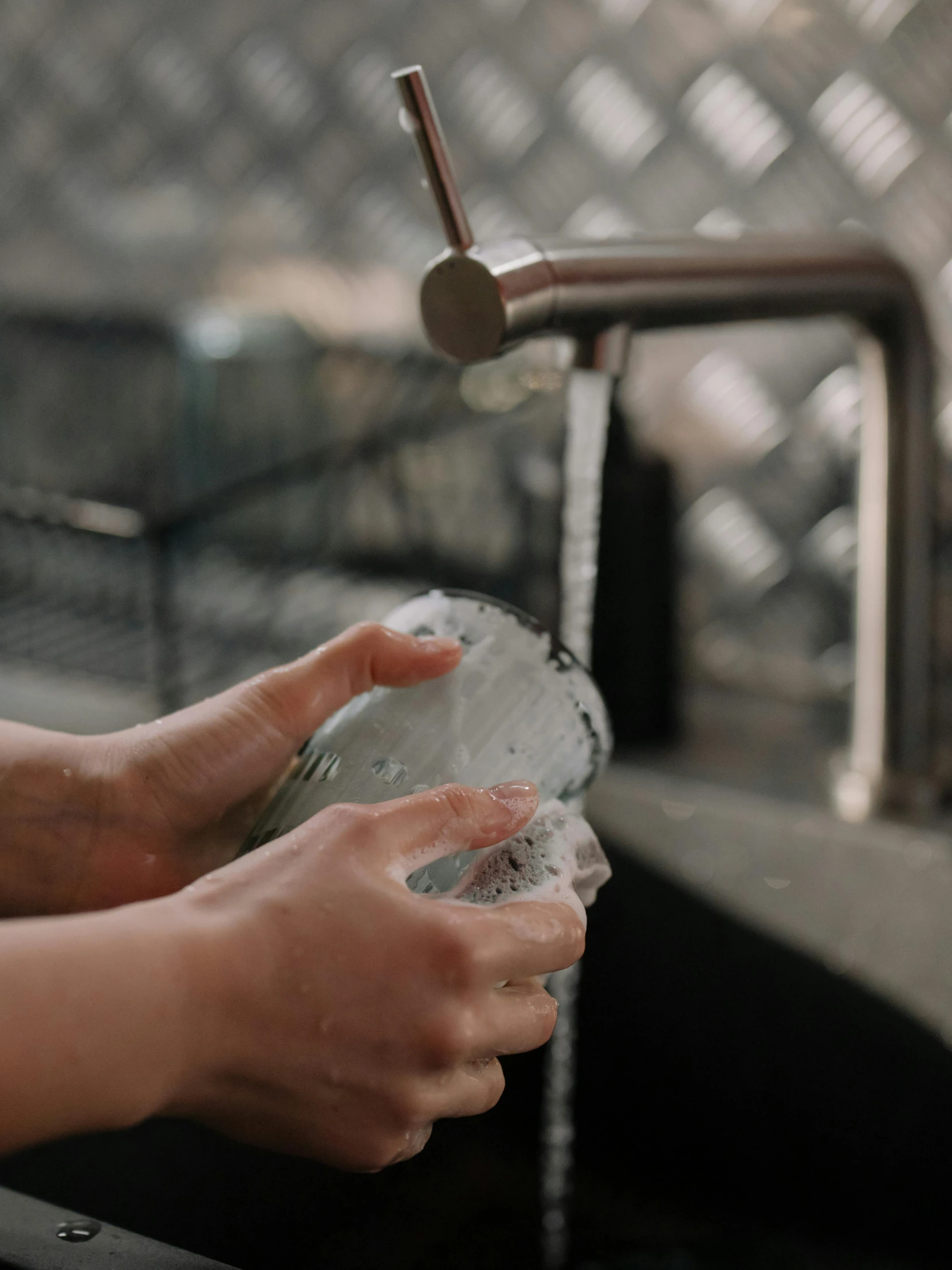 a person washing their hands in a sink, by Matija Jama, pexels, person made out of glass, family friendly, profile image, made of water