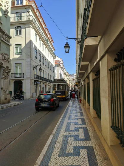 a street filled with lots of traffic next to tall buildings, lisbon, profile image