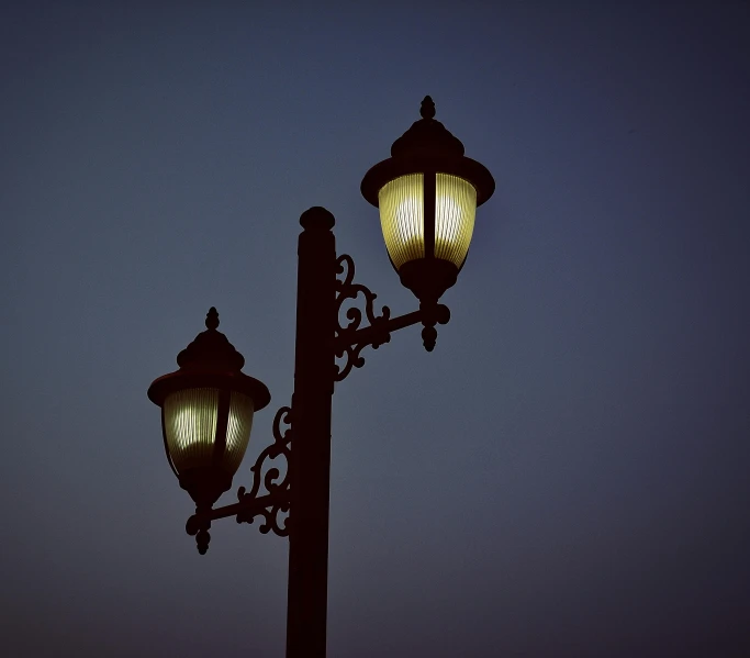 a couple of street lights sitting next to each other, square, outdoor lighting, retro lights, low-light photograph