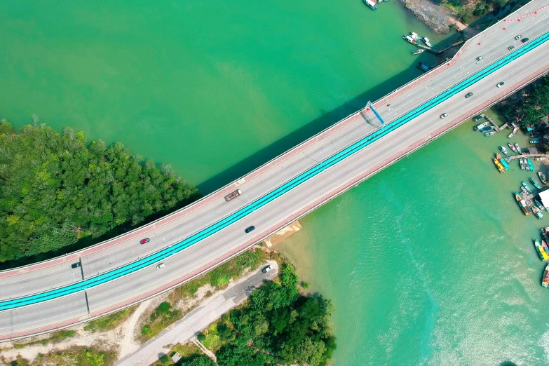 an aerial view of a bridge over a body of water, pexels contest winner, advanced highway, blue and green water, thumbnail, singapore