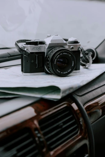 a camera sitting on top of a car dashboard, by Sven Erixson, unsplash contest winner, photorealism, medium format. soft light, canon a1, 35mm —w 1920 —h 1080, rolleiflex