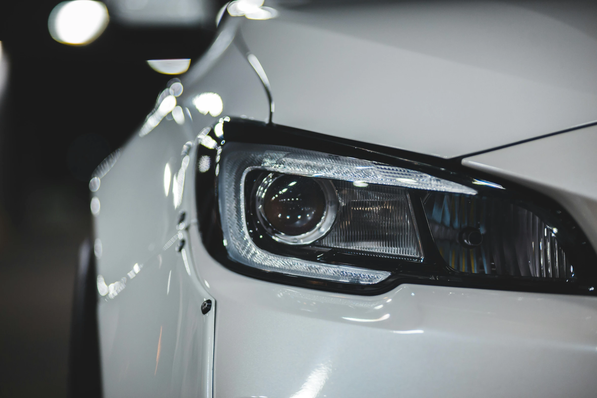 a close up of a headlight on a white car, pexels contest winner, volumetric lighting - h 7 6 8, instagram post, side lights, white metallic