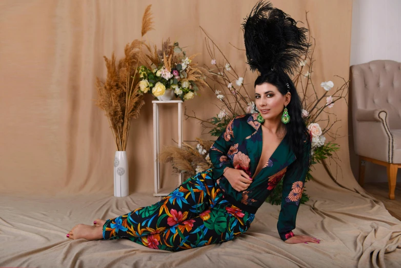 a woman that is laying down on a bed, by Lisa Milroy, maximalism, flowers in her dark hair, bright trouser suit for a rave, arab ameera al taweel, woman with black hair