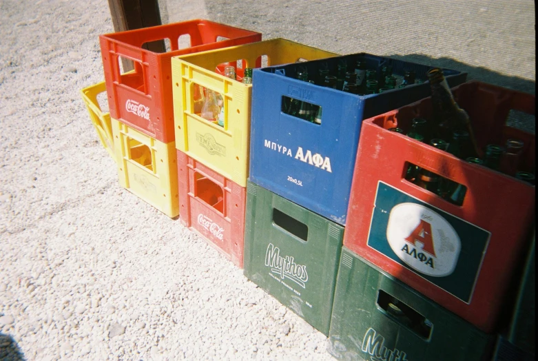 a bunch of crates stacked on top of each other, by Tuvia Beeri, early 2 0 0 0 s, sparkling in the sunlight, colorful plastic, agharta