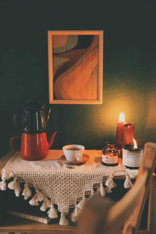 a tea pot sitting on top of a wooden table, a still life, inspired by Elsa Bleda, pexels contest winner, cozy candlelight, interior of a small room, red and green color scheme, breakfast