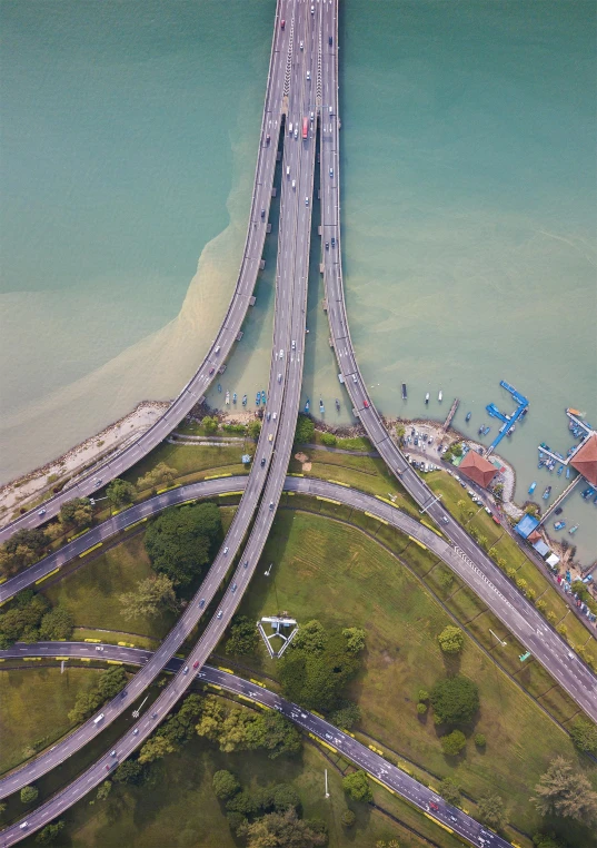 an aerial view of a bridge over a body of water, pexels contest winner, hyperrealism, malaysian, highways, ilustration, high resolution photo