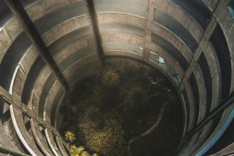 a spiral staircase going up to the top of a building, inspired by Filip Hodas, crawling in a wet sewer pipe, alessio albi, ultra realistic 8k octan photo, fallout environment