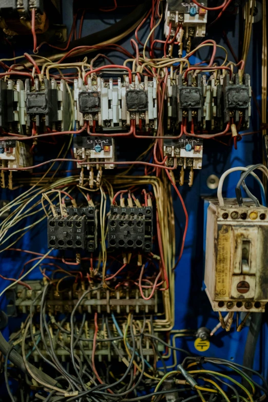 a close up of a bunch of electrical wires, by David Simpson, unsplash, renaissance, old experimentation cabinet, panels, overlooking, retro machinery