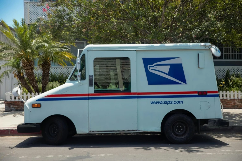 a mail truck parked on the side of the road, a portrait, unsplash, getty images, blue print, full body close-up shot, 2 0 1 0 s