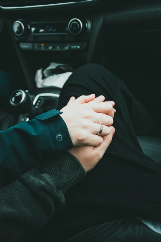 a man and a woman holding hands in a car, colour corrected, non-binary, comforting, 2019 trending photo