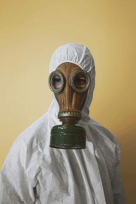 a man in a protective suit and gas mask, an album cover, pexels contest winner, plain background, burka, chemistry, dan witz