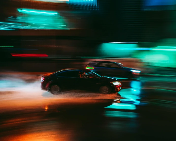 a car driving down a city street at night, pexels contest winner, visual art, high speed chase, everyone having fun, mechanical features and neon, wet streets