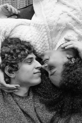 a black and white photo of a man and a woman, by Maurycy Gottlieb, curls on top, happy cozy feelings, circa 1 9 7 9, ( ( photograph ) )