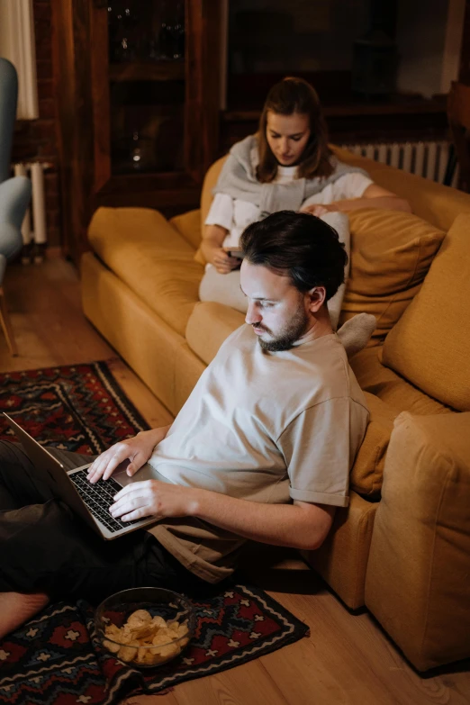 a couple of people sitting on a couch with a laptop, lachlan bailey, busy room, thumbnail, old world