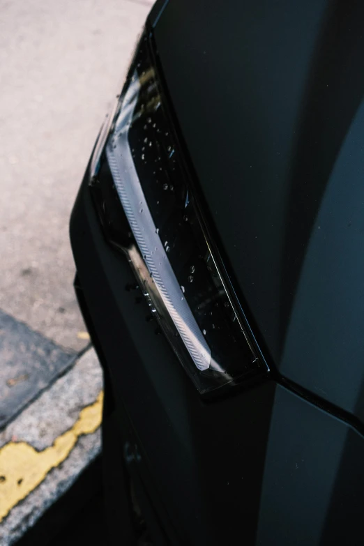 a black car parked on the side of the road, face details, captured on canon eos r 6, square nose, accent lighting : : peugot onyx