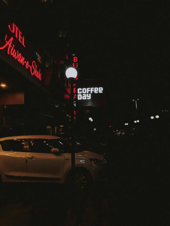 a car parked in front of a coffee shop at night, dark dance photography aesthetic, ((((((((night)))))))) day time, bright signage, drinking coffee