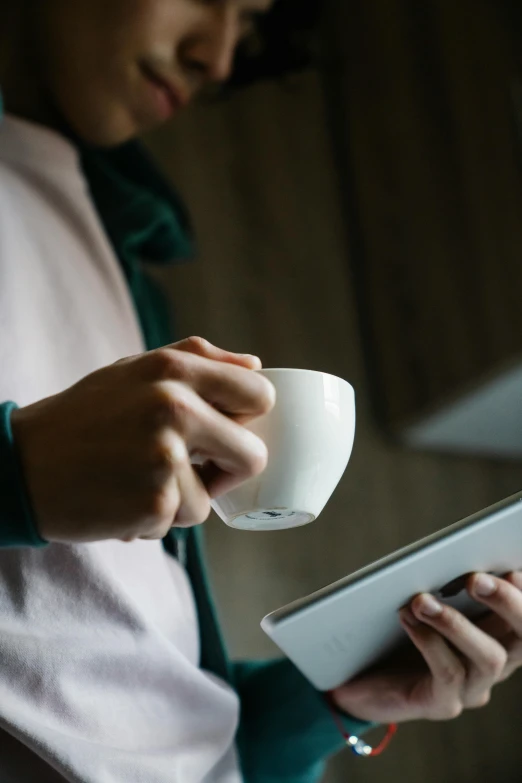 a close up of a person holding a cup and a tablet, happening, large)}], multiple stories, morning, premium