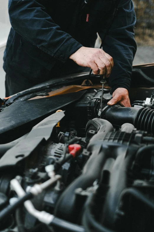 a man is working on a car engine, pexels contest winner, renaissance, a man wearing a black jacket, thumbnail, 1 2 9 7, high quality print