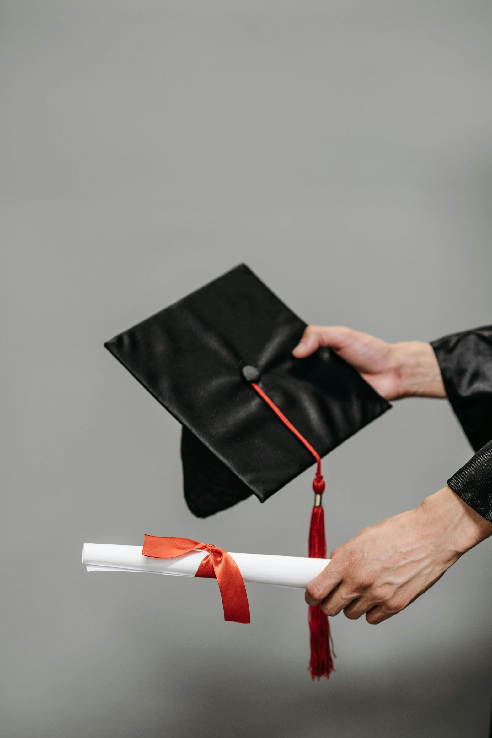 a person holding a graduation cap and diploma, pexels, streamers, low quality photo, inspect in inventory image, black