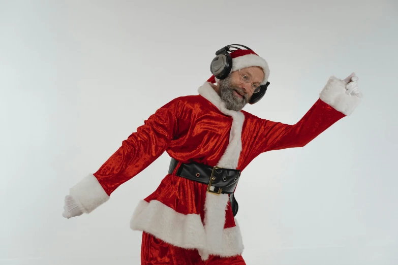 a man in a santa suit on a snowboard, an album cover, pexels, happening, headphones dj rave, 5 5 yo, terry richardson, h3h3