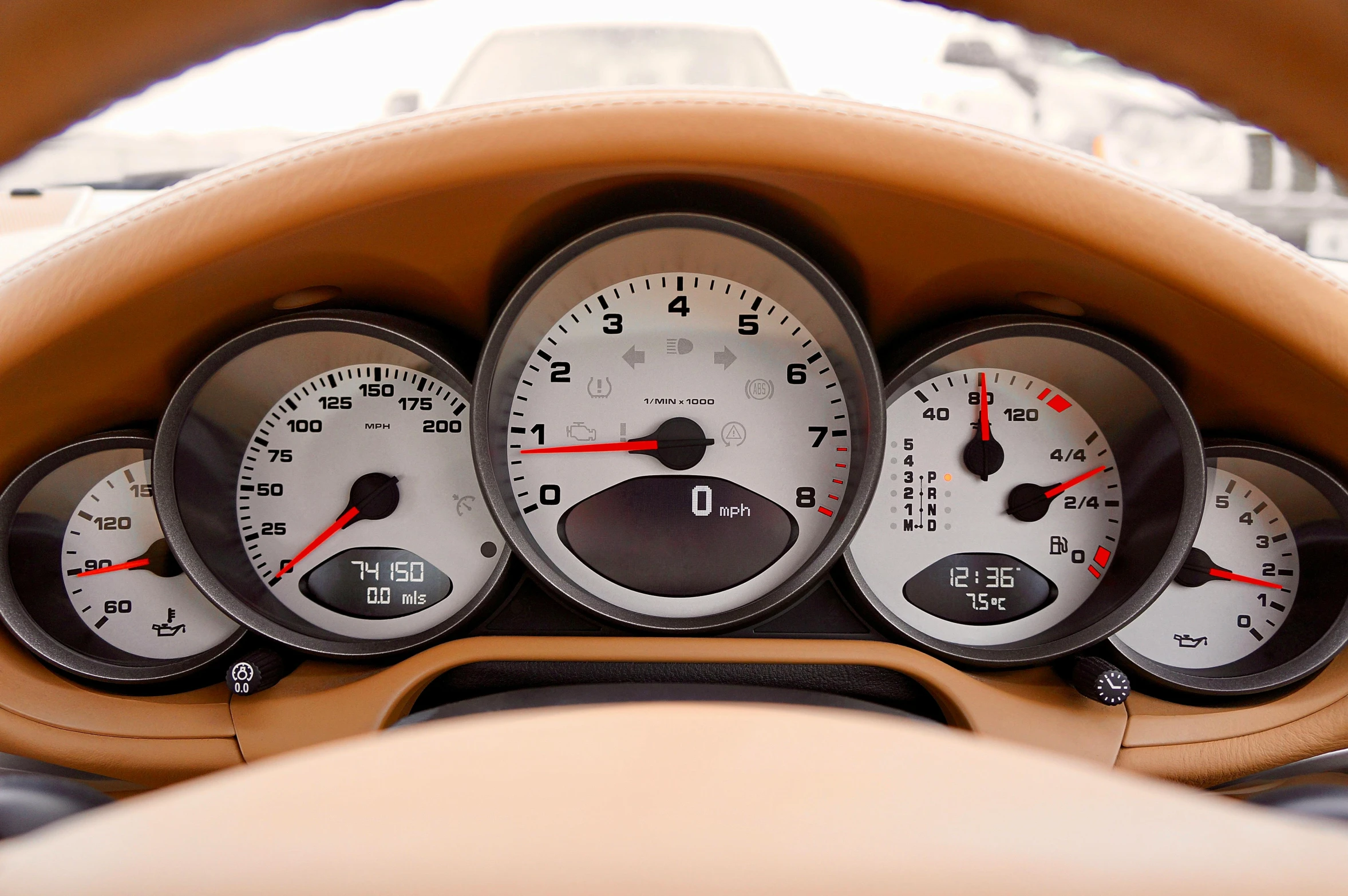 a close up of a dashboard of a car, inspired by Harry Haenigsen, unsplash, les automatistes, white, taken in the late 2000s, gauges, porche