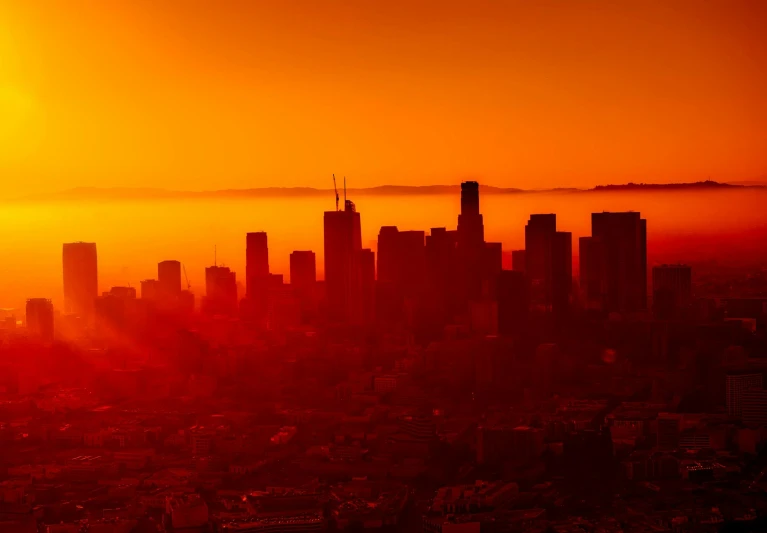 the sun is setting over a large city, by Matt Stewart, gradient red, los angelos, glowing particulate, glowing red