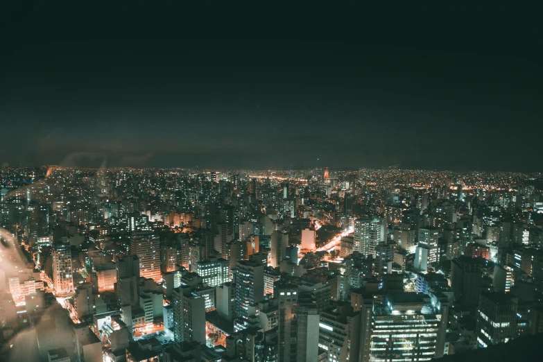 an aerial view of a city at night, inspired by Elsa Bleda, pexels contest winner, futuristic sao paulo, nightlife, view, high resolution