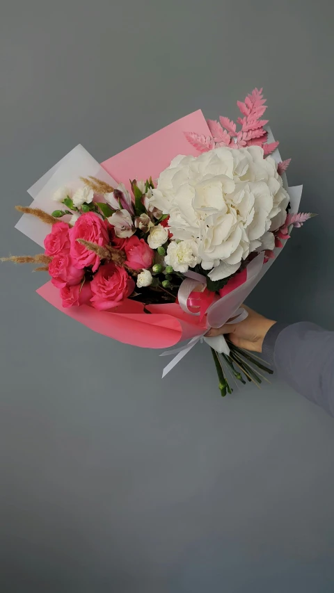 a person holding a bunch of pink and white flowers, clean and pristine design, award - winning, sweet hugs, greek